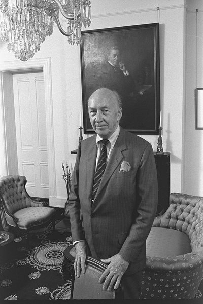 S. Dillon Ripley Standing in Parlor