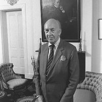 S. Dillon Ripley Standing in Parlor